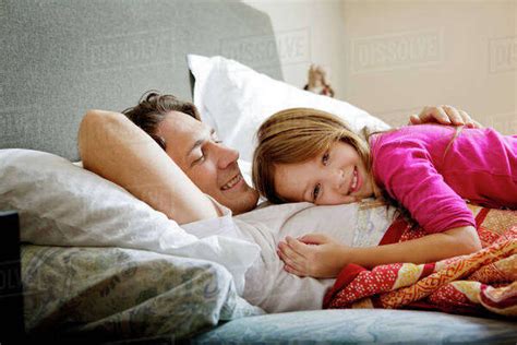 Step father allows daughter to cuddle up with him 